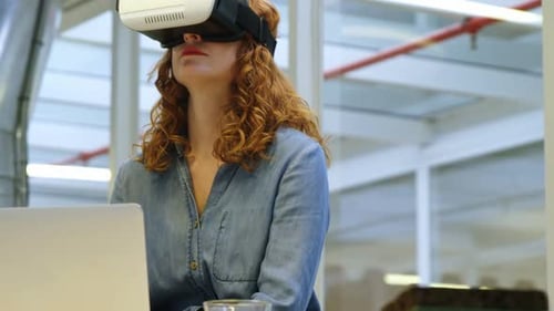 Woman Uses VR Headset in Bright Office