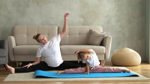 Woman and Girl Stretching at Home Together