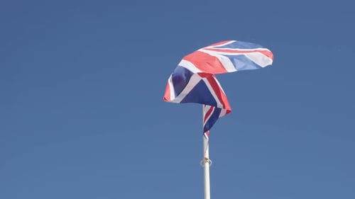 Famous United Kingdom state symbol fabric on flagpole slow-mo 1920X1080 HD footage - Slow motion of