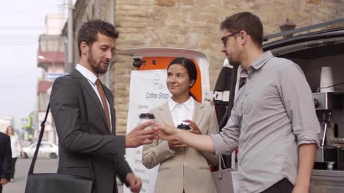 Office Workers Buying Coffees from Mobile Van and Walking Away
