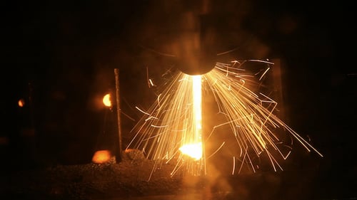 Laser Cutting Metal Sheet in Industrial Setting