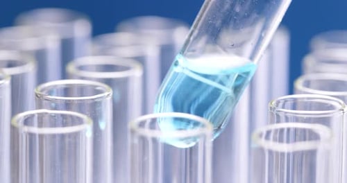 Adding Blue Liquid to Test Tube Collection