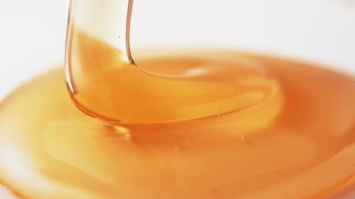 Thick honey dripping. Slow Motion.