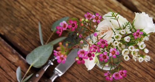 Floral Arrangement on Wooden Table