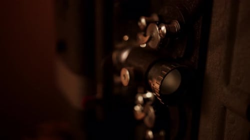 Vintage Film Projector Mechanisms in Warm Light