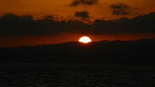 Ocean Sunset with Glowing Clouds