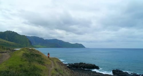 Couple walking on the hill near the sea coast 4k