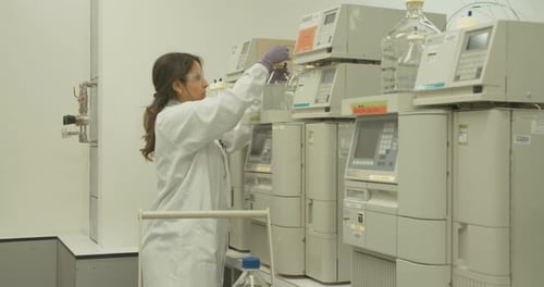 Scientist Working with Equipment in Modern Laboratory