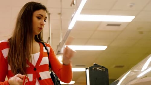 Woman Browsing Fresh Meat Section at Grocery Store