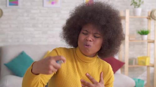 Woman Using Inhaler During Asthma Attack