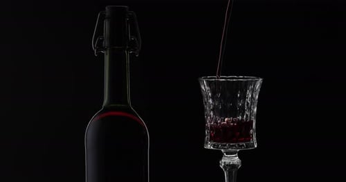 Wine Being Poured Into Stemmed Glass Close Up