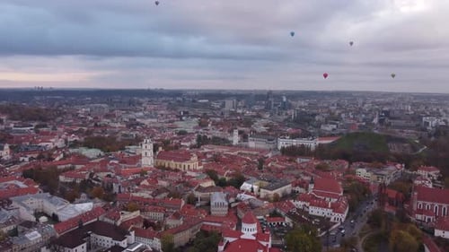 Hot Air Balloons above Vilnius Old Town Aerial Establishing View, Dusk