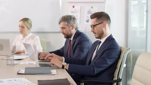 Businesspeople Working Together at a Conference Table