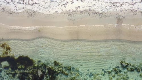Top View of the Transparent Sea with Beautiful Waves on a Sunny Day in Summer