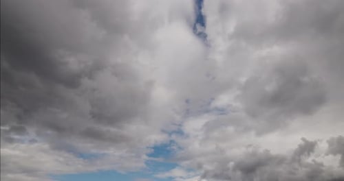 Storm Clouds Rolling Across Cloudy Sky