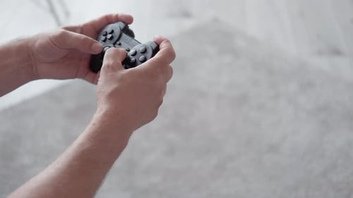 Hands on a Game Controller Playing