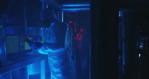 Scientists Working in a Futuristic Laboratory at Night