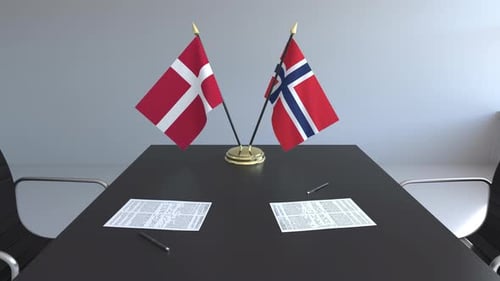 Denmark Norway Flags on Meeting Table for International Agreement