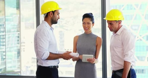 Architects interacting with each other in a modern office 4k