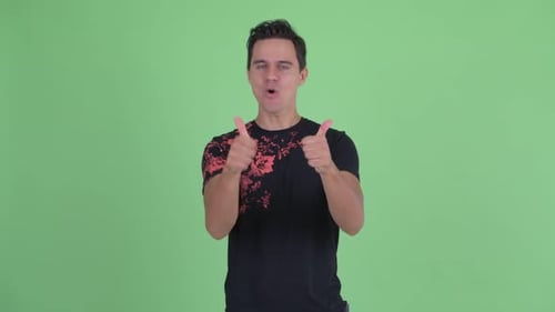 Enthusiastic Young Adult Giving Double Thumbs Up