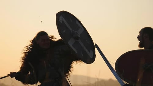 Two Warriors Sword Fighting at Sunrise