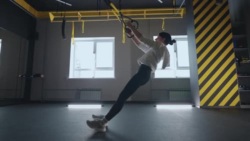 Fitness Woman Workout Exercise with Trx Equipment in the Fitness Gym Healthy Lifestyle Building