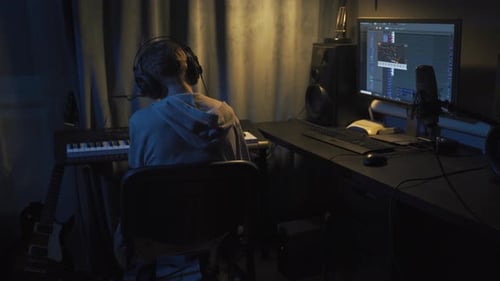 Teenager at Home Composes Music In His Home Sound Studio