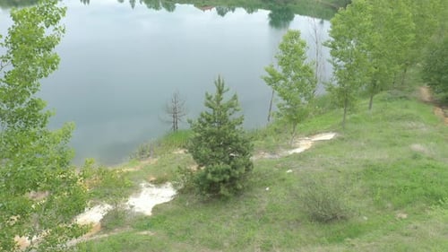 Coastal area and crystal clear water of lake 4K drone footage