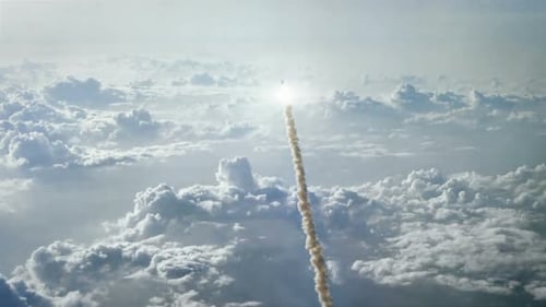 Rocket Launching Through Clouds into Space