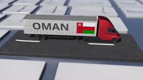 Flag of Oman on Moving Truck and Computer Keyboard