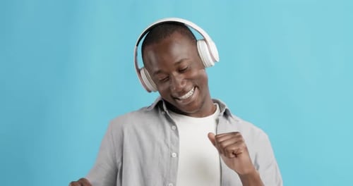 Man Listening to Music and Dancing to Beat