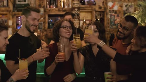 Cheerful Friends Having Party at Bar