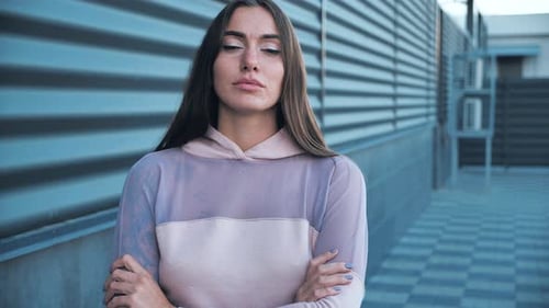 An Attractive Woman Poses for the Cameras Female Straightens Her Hair Winks and Flirts at City