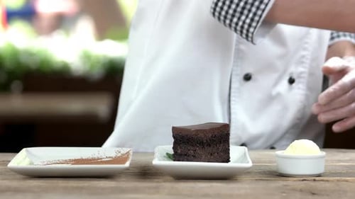 Chef Preparing Chocolate Cake with Cocoa and Mint