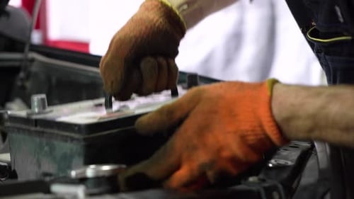 Mechanic Replacing Car Battery