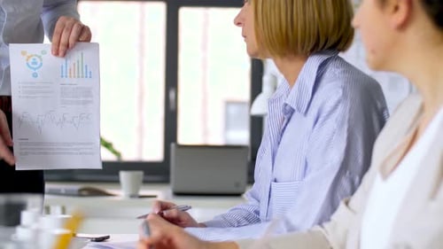 Business Team at Office Meeting or Presentation