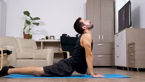 Fit Man Does Different Yoga Poses