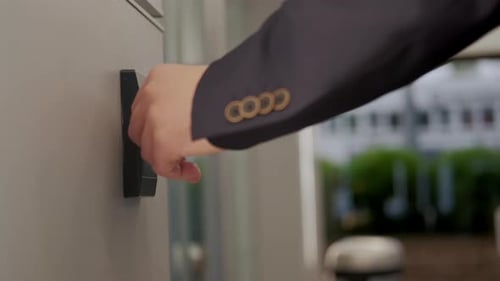 Man in Suit Opens the Door to Office Building Using a NFC Key Card