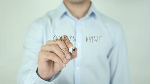 Man Writes Domain Name Service on Clear Screen