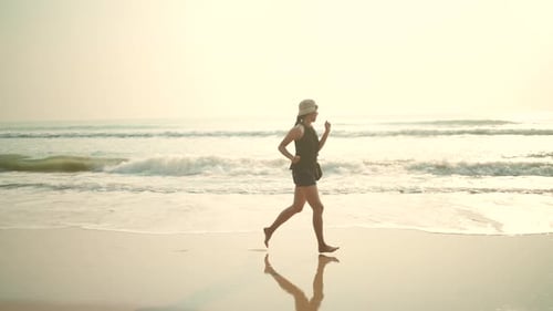 Asian woman happy and relaxing in freedom vacation time at the tropical san beach, natural sea beach