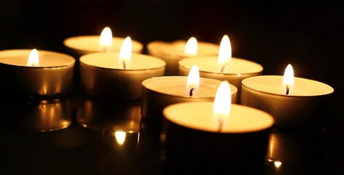 Illuminated Candles Glowing in the Dark