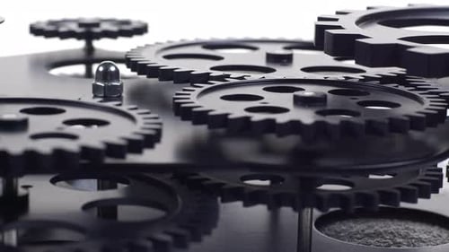 Rotating Gears Close-Up on White Background