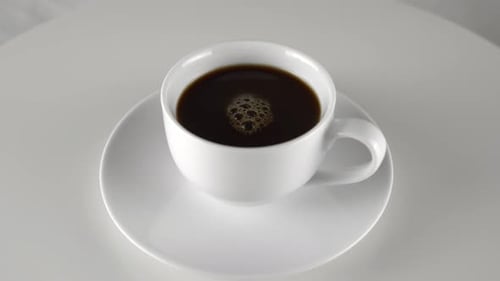 Close Up of Dark Coffee in White Cup