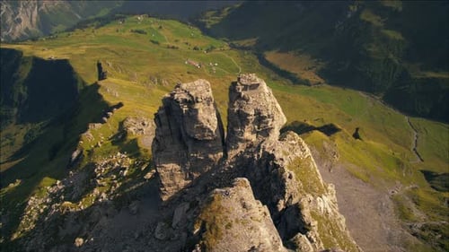 Descending dolly shot of rock formation near the Swiss alps