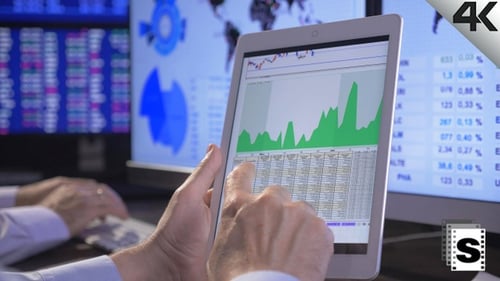 Financial Data Analysis on Tablet at Workplace