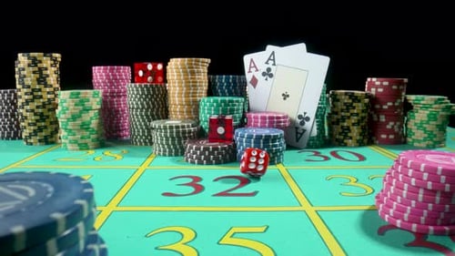 Set of Colorful Chips Playing Cards and Red Dice on a Gaming Table for Gambling in a Casino