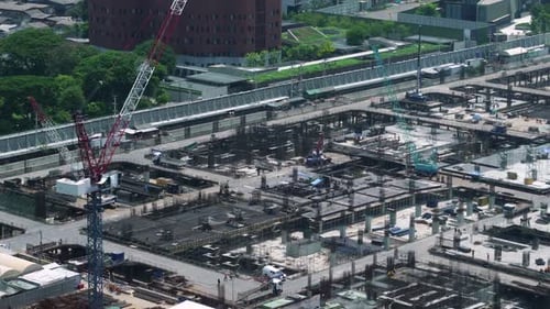 Large Construction Site with Heavy Construction Machinery in Metropolis