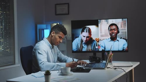 Young Adult Working at Desk on a Video Call