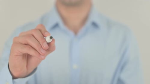 Man Writes Strategy on Glass, Close Up