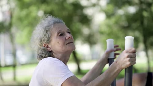 Senior Woman Exercising in Park, Staying Healthy